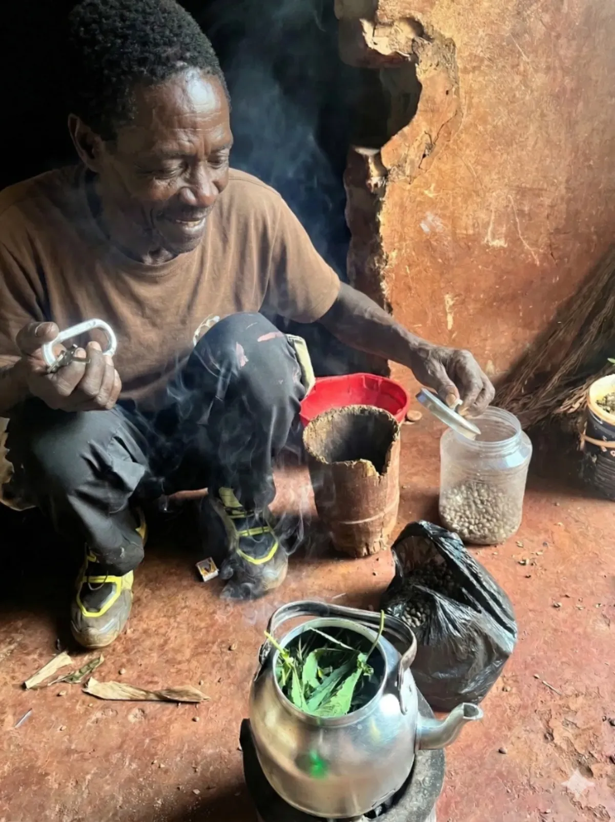 Brewing herbal tea over a charcoal stove