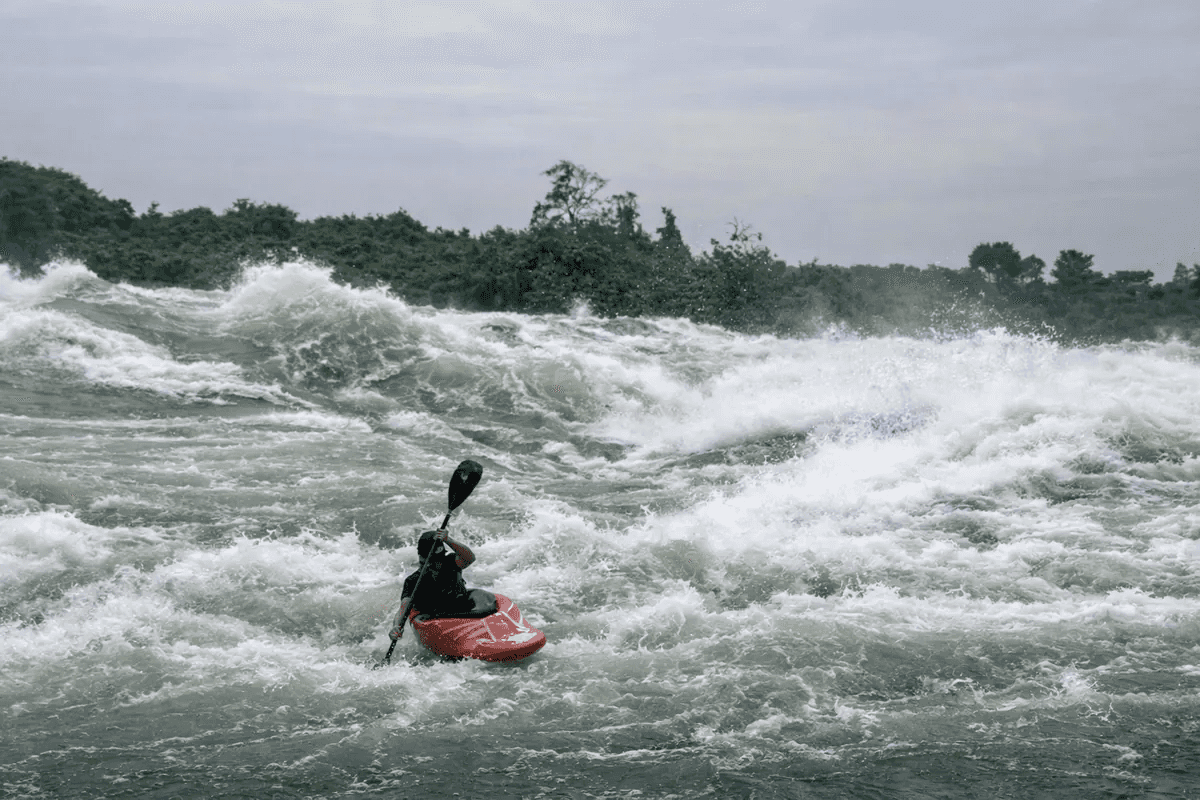 Kayaker navigating powerful white water